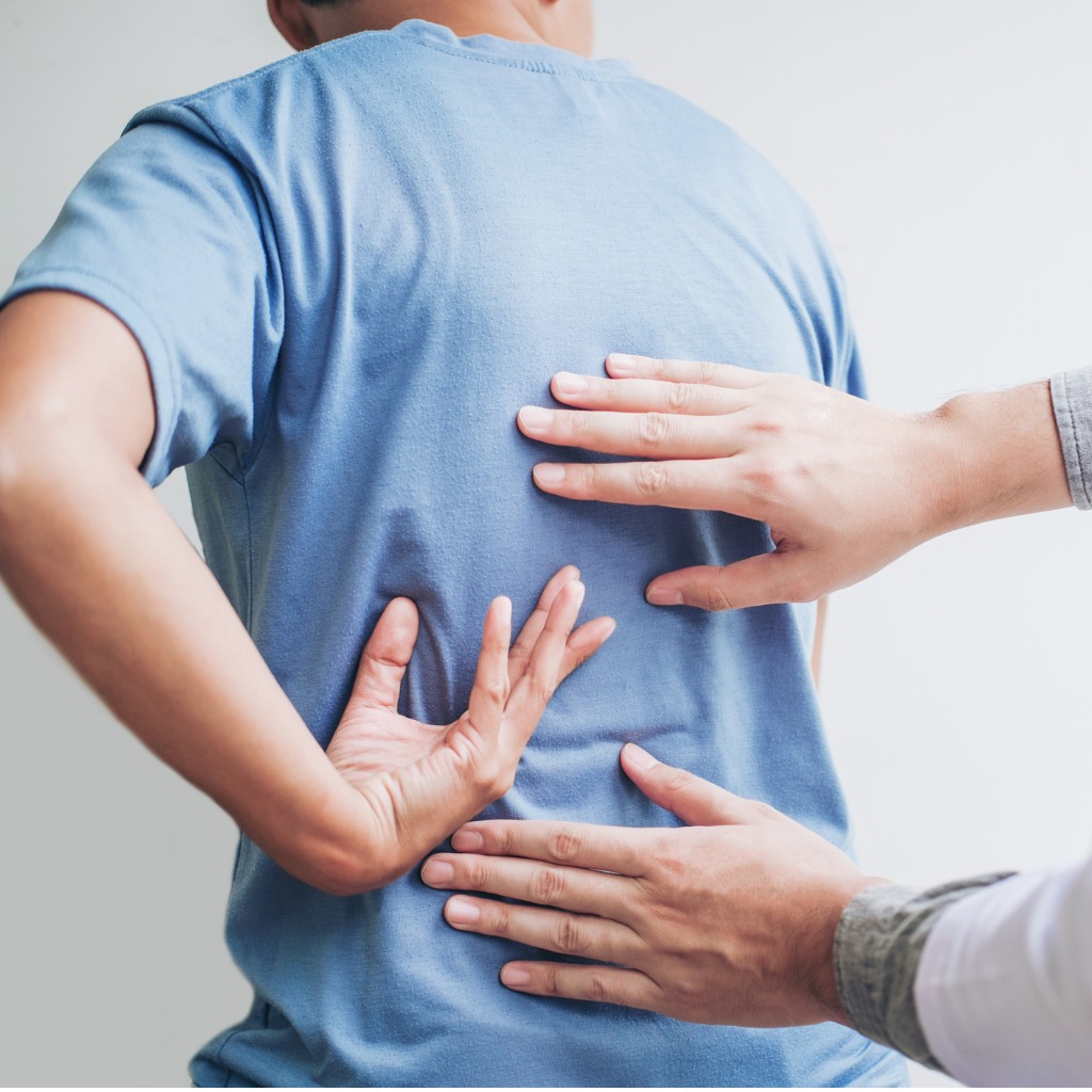 doctor consulting with patient back problems physical therapy concept picture id1007757616